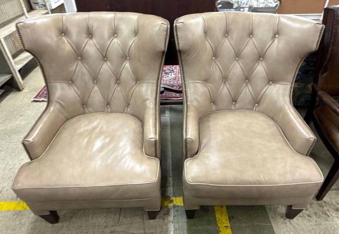 pair of tufted leather arm chairs: Each 41" x 33" x 38"