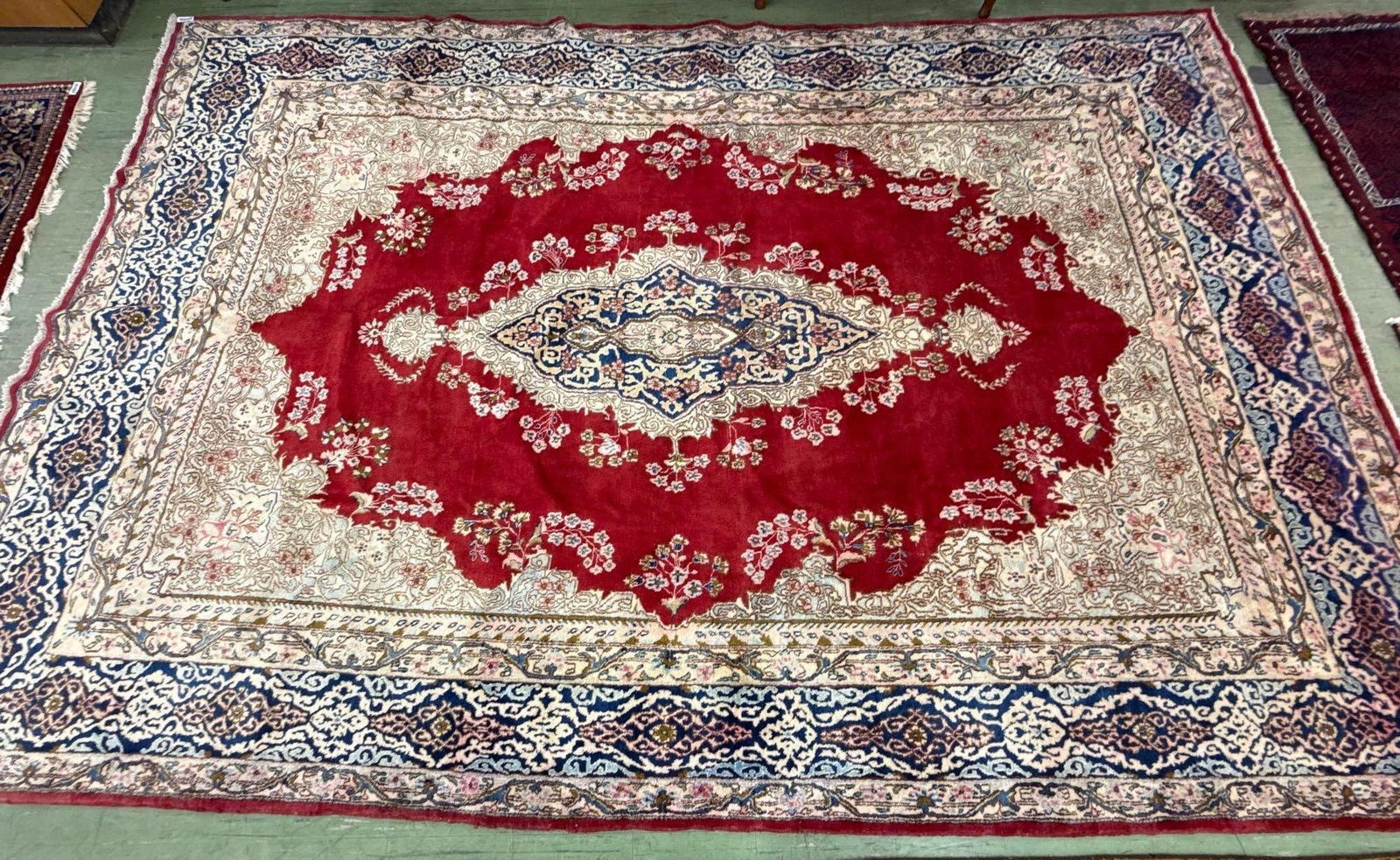 room size rug 14'1" x 9'4": Made in Kerman, Iran. wool over cotton. 14'1" by 9'4"