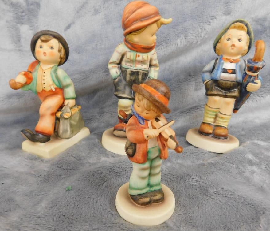 Goebel - M.I. Hummel - 4 Pieces - #837 "Home From Market" - #977 "Merry Wanderer": #962 March Winds" - #426 "Little Fiddler" - Original Boxes - See Photos For Description and Condition