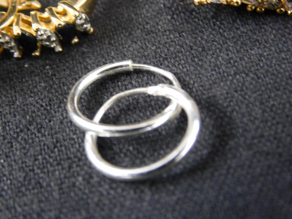 Sterling Silver - 7 Pairs of Hoop Earrings - 28.77 Grams TW - 7