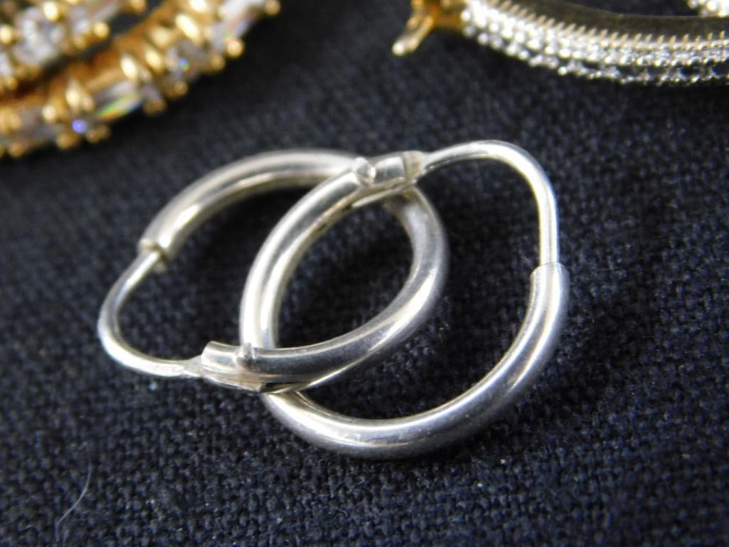 Sterling Silver - 7 Pairs of Hoop Earrings - 28.77 Grams TW - 8