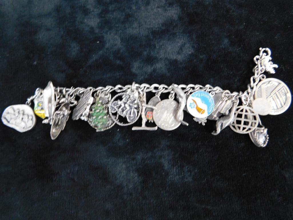 Sterling Silver - Charm Bracelet - 67.99 Grams TW - 12