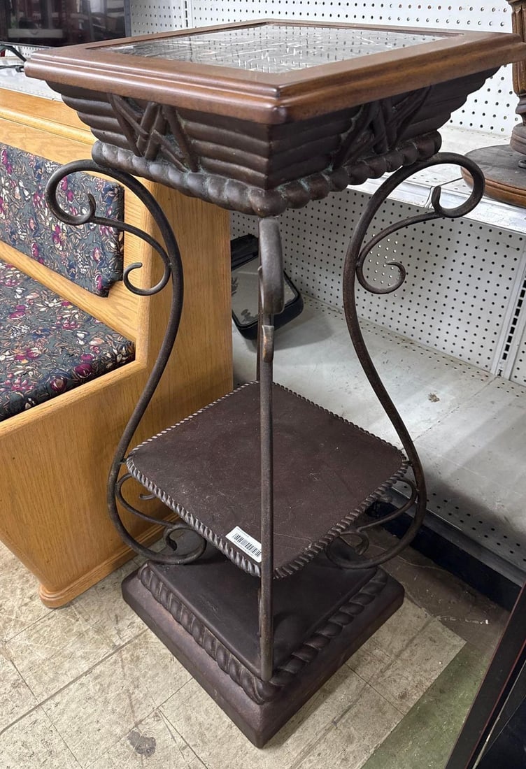 Metal plant stand with mosaic top: Wood and marble mosaic top. Scroll work on corners. 14 by 14 by 34.