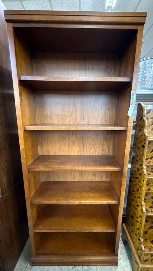 wooden bookshelf: Heavy, with five adjustable shelves . 26 wide by 1 foot deep by 6 feet tall.