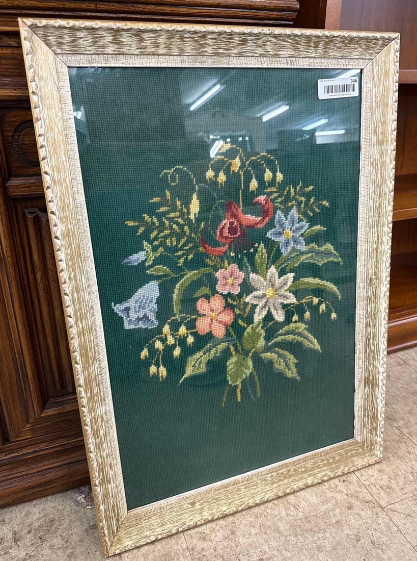 framed needlepoint floral artwork: 17 wide by 23 tall.