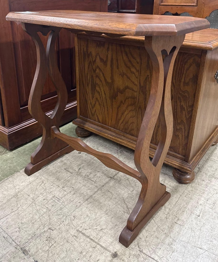wooden side table: lyre-shaped supports and a stretcher base. Some water damage to the top. 22 wide by 11 deep by 23 tall.