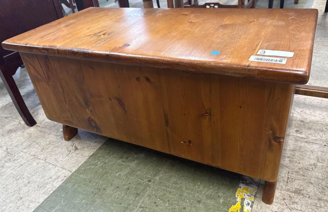 solid wooden chest: Knotty pine. 211 wide by 15 deep by 16 tall.