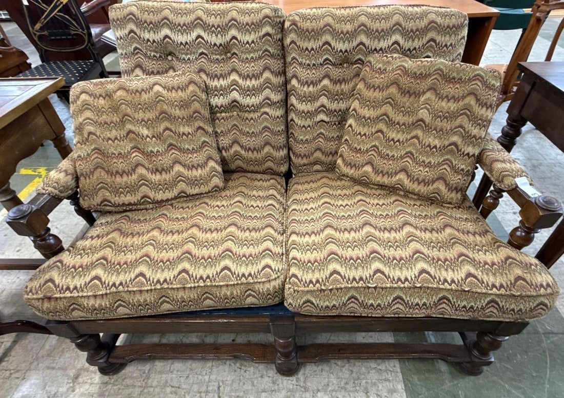 1970s carved wooden loveseat: Chevron pattern upholstery fabric. 4 feet wide by 24 deep by 210 tall.