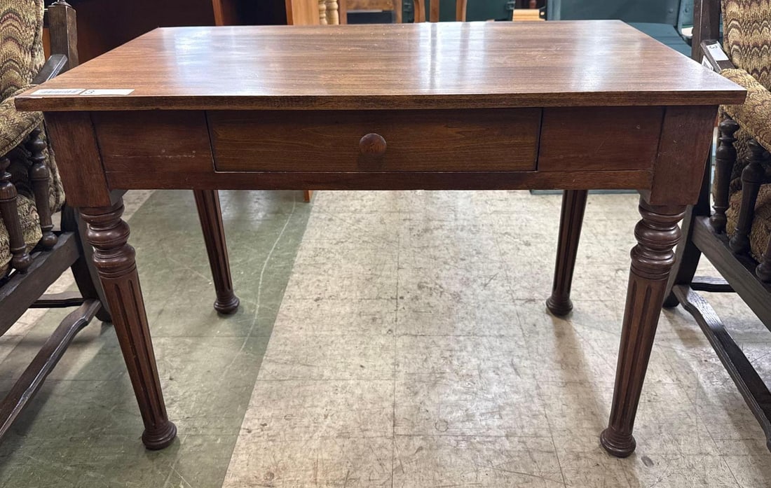 writing table: Turned legs, single drawer. 32 wide by 19 deep by 24 tall. Dark stain.