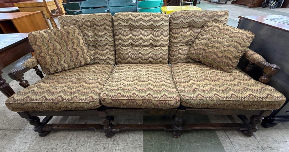 1970s carved wooden sofa: Chevron pattern upholstery. 72 inches wide by 36 inches deep by 34 inches tall.