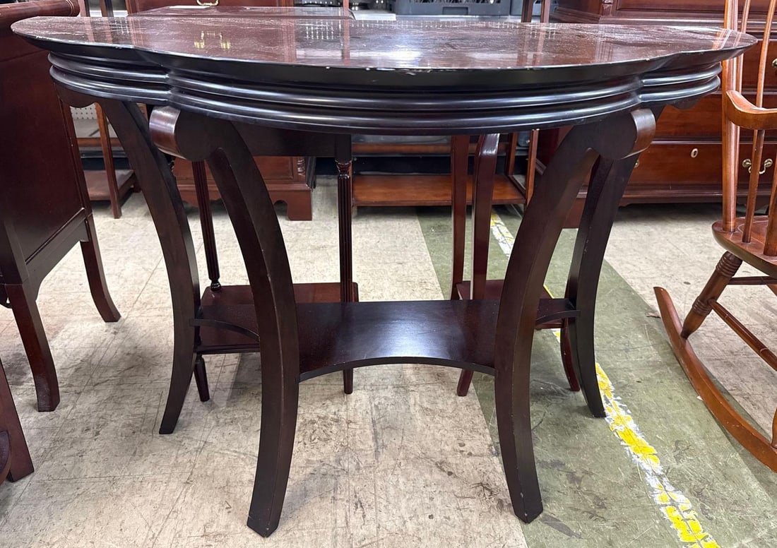 Cherry side table: Curved legs, curved top and shelf. 38 wide by 18 deep by 28 tall