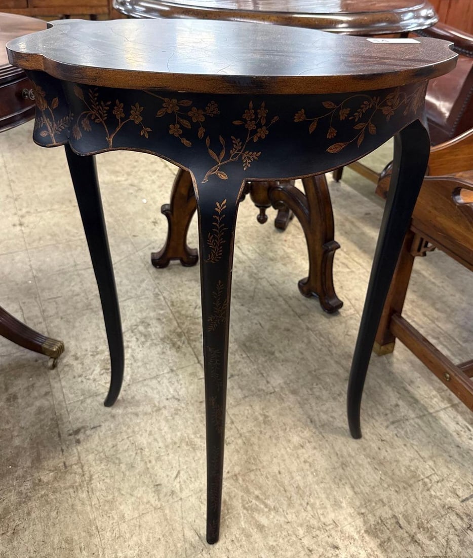 asymmetrical side table: Black lacquer with painted botanical motif. 22 1/2 inches wide by 14 inches deep by 30 1/2 inches tall.