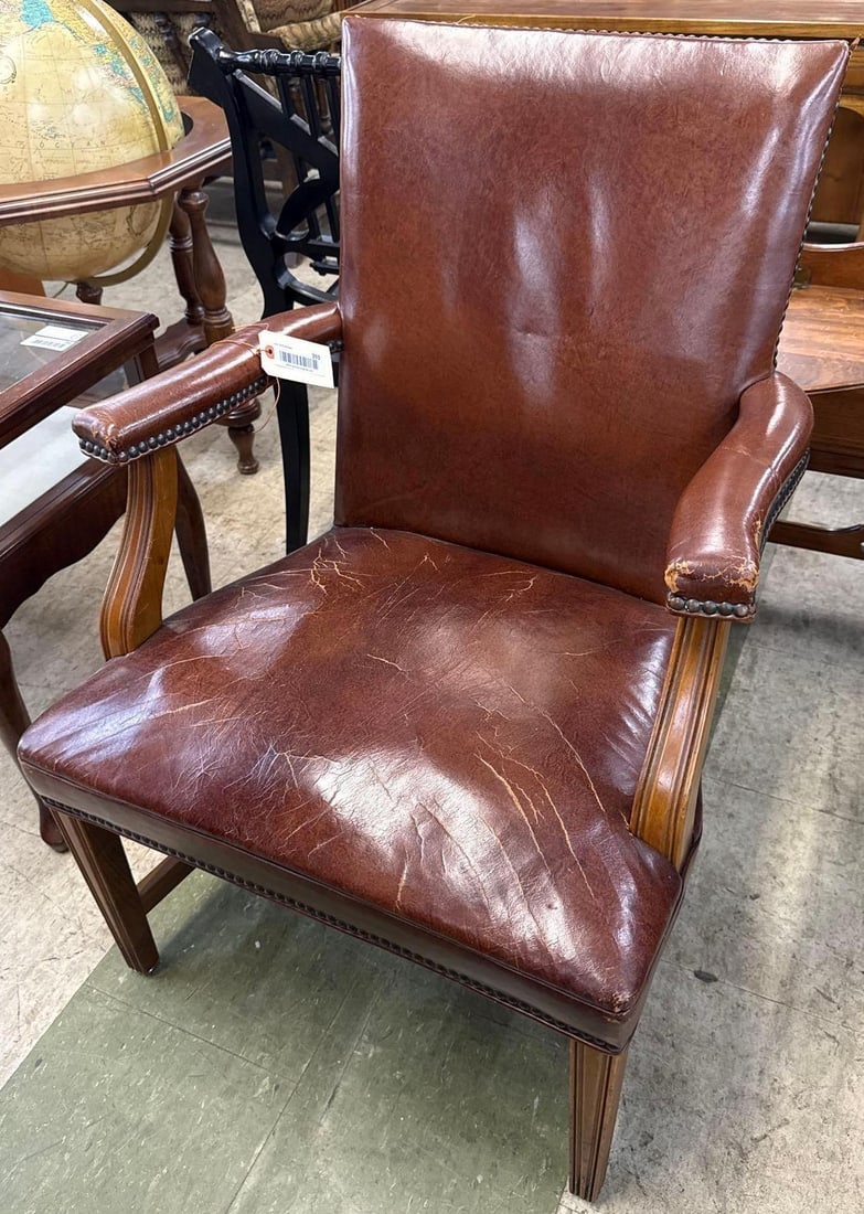 Brown leather arm chair: See photos for condition issues. 26 inches wide by 25 inches deep by 36 inches tall