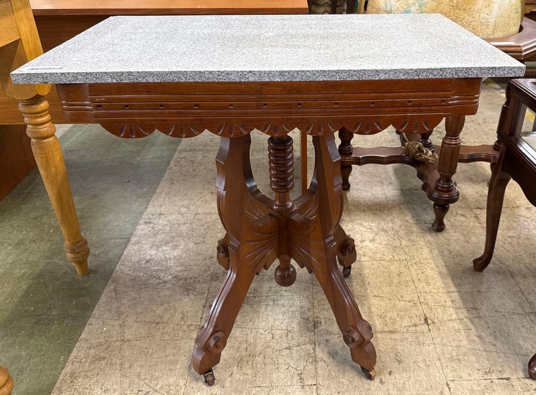 eastlake marble top table: On casters 30 inches long by 19 inches deep by 29 1/2 inches tall