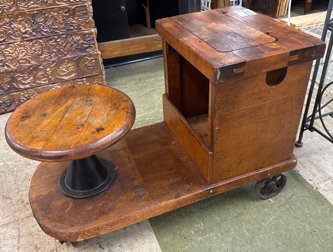 vintage workbench from textile mill: Wooden on industrial casters. 34 inches wide by 17 inches wide by 23 inches tall.