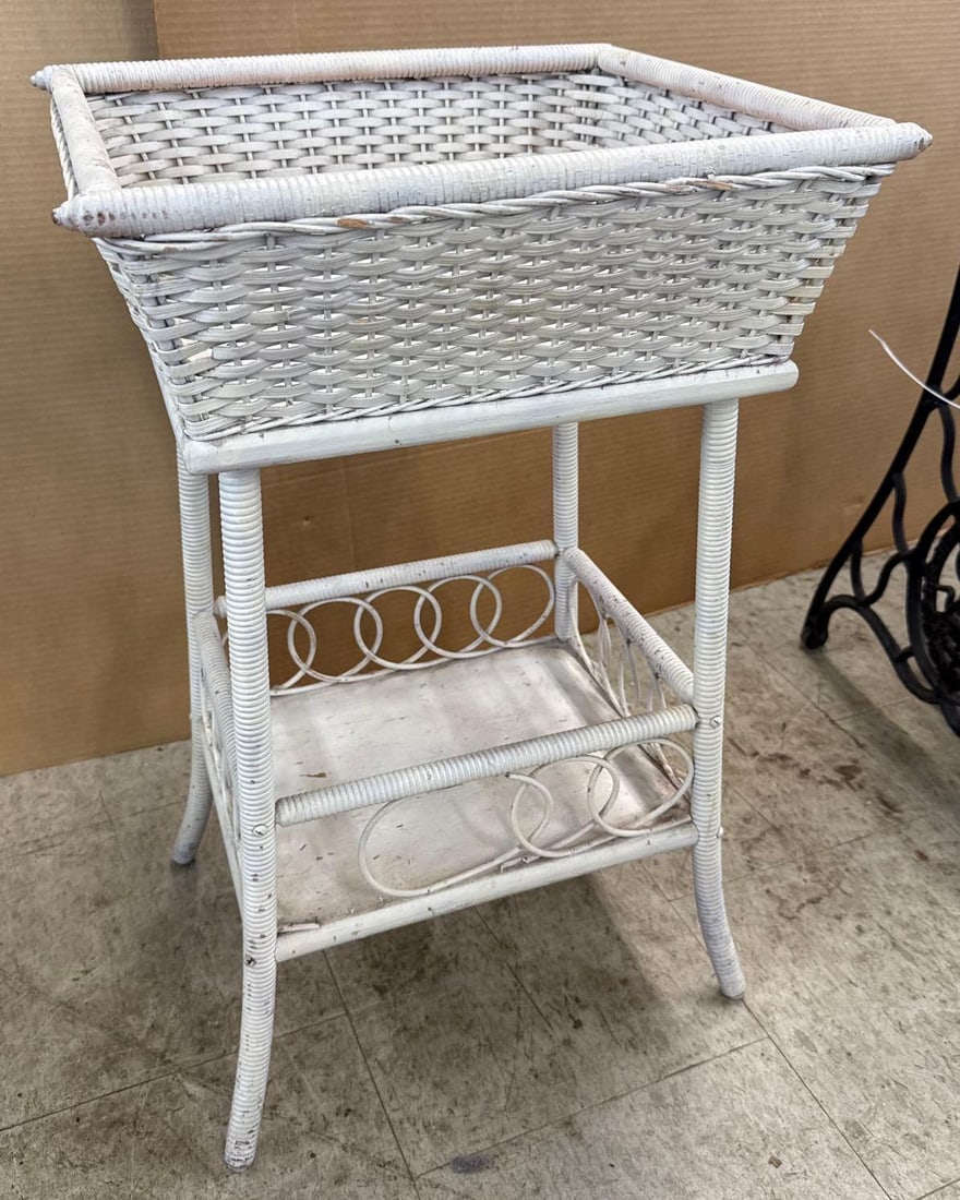 White wicker plant stand: 27 inches tall 17 inches wide 15 inches deep.