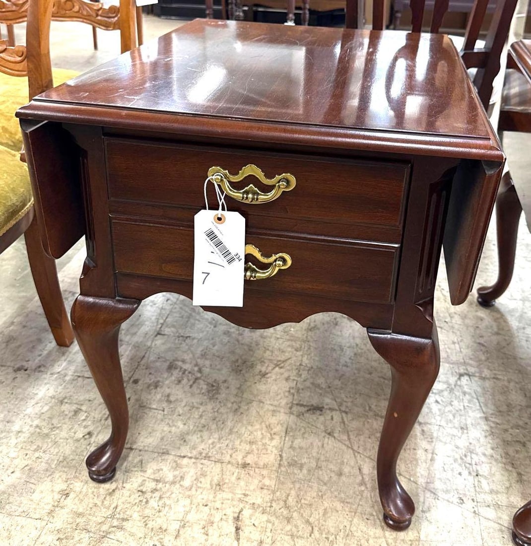 mahogany stain drop leaf side table: 23 1/2 inches tall. With leafs up 35 inches wide 28 inches deep. With the leafs down its 21 1/2 inches wide