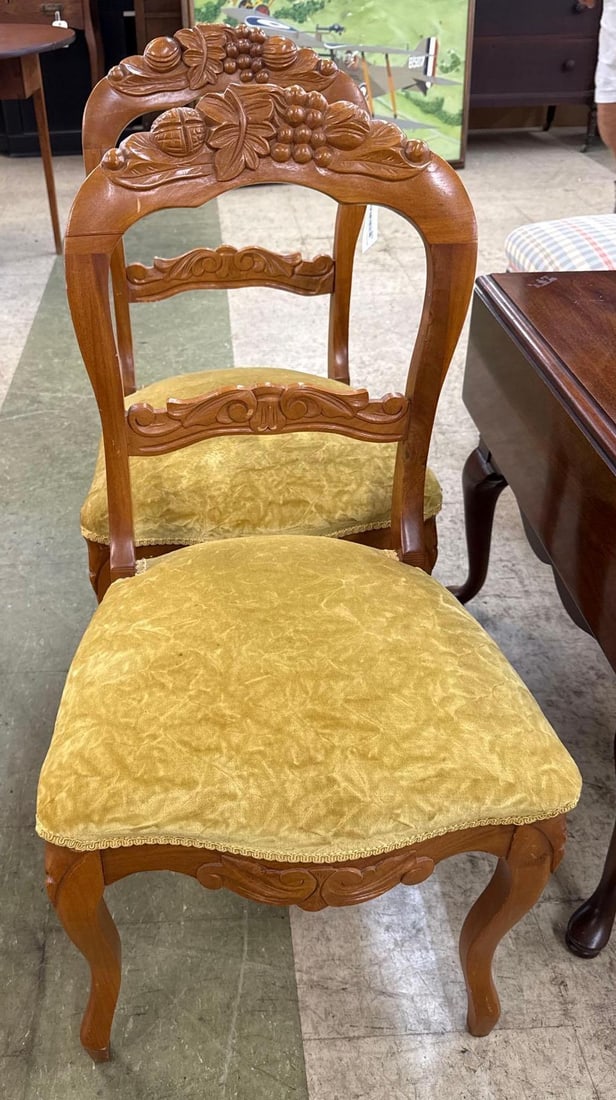pair of dining room chairs with crushed velvet seats: 34 inches tall 19 inches wide 18 inches deep. Carved wood backs