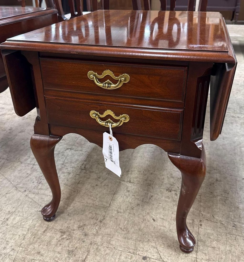 mahogany stain drop leaf side table: 23 1/2 inches tall. With leafs up 35 inches wide 28 inches deep. With the leafs down its 21 1/2 inches wide