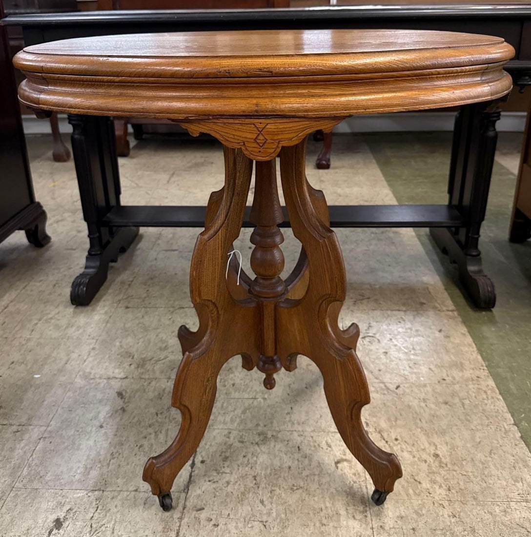 vintage EastLake oval table: Oak. 28 1/2 inches tall 28 inches wide 22 inches deep