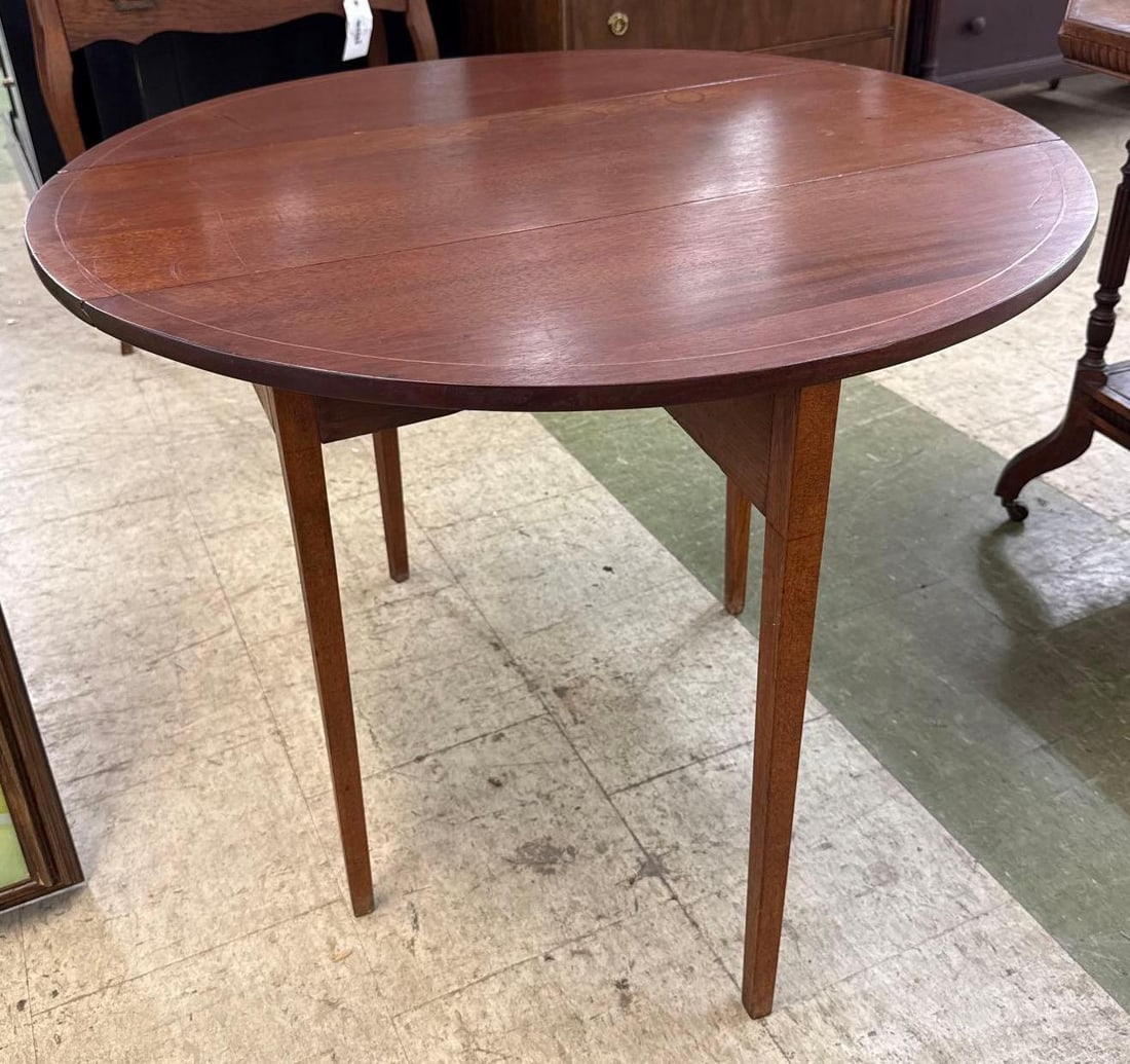 round gate leg table: 27 1/2 inches tall 36 1/2 inches wide when leaves are up 14 1/2 inches wide when leaves are down. Inlaid detail in top.
