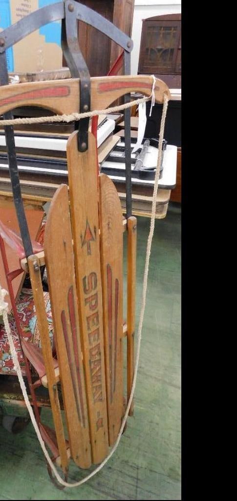vintage wooden Speedaway sled with metal runners: Rope attached. 6 x 57 x 22 inches.