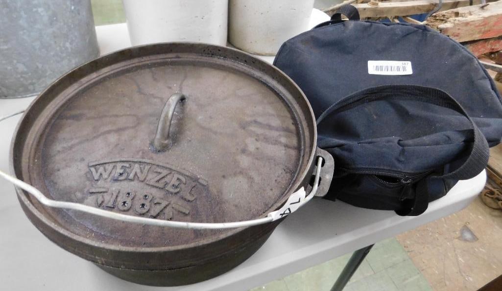 cast-iron lidded pot with carrying case: Wenzel 1887 5 inches tall by 14 inches wide, including the handles.