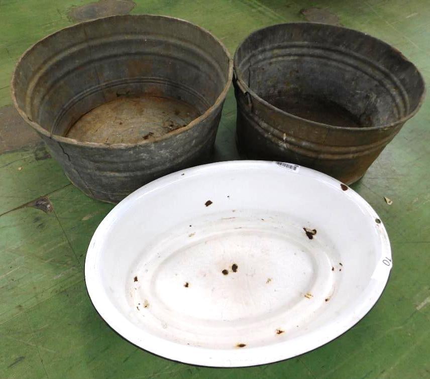 lot of three vintage tubs: Two round galvanized and one is oval enamel. large round tub has handles 12 x 22 1/2 smaller round bucket has handles 11 1/2 x 20 oval enamel has one hole on one end 6 1/2 inches x 25 x 18 1/2.