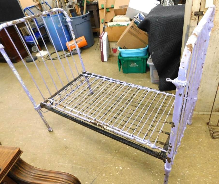 antique iron childs bed: Painted purple 45 x 54 x 29 1/2. Includes the Side railings