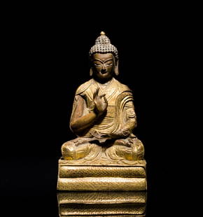 19th Antique Gilt Sino-tibetan Buddha: Seated in vajraparyankasana with hands held in dharmachakra mudra, dressed in a long pleated robe, draped over one arm, all supported on a lotus pedestal. 8.75 inch H