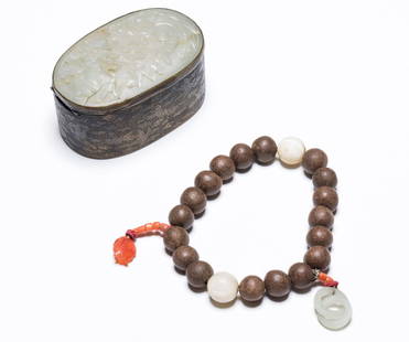 18-19th Antique String Agarwood Prayer Beads: Comprising of eighteen circular agarwood beads, equally spaced by two mother of pearl beads and further enhanced by two coral beaded strings one leading to a interlocking jade rings, one leading to a