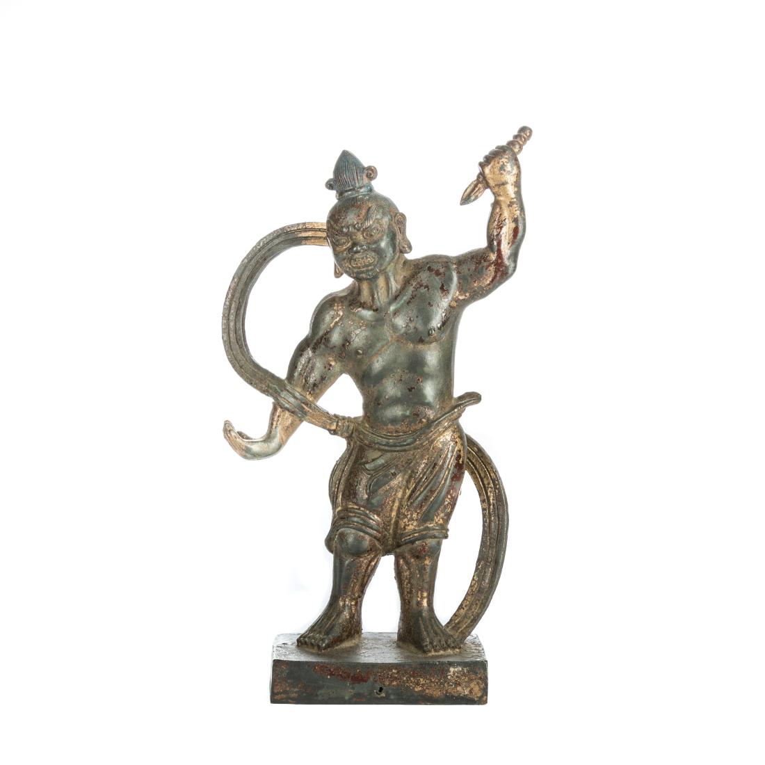 Ming Antique Gilt Bronze Kuixing Diandou: The deity standing firmly on his feet, holding an ingot in his left hand raised over his head and right hand holding posture in lower position, revealing the scene of kuixing dian dou, his face with f