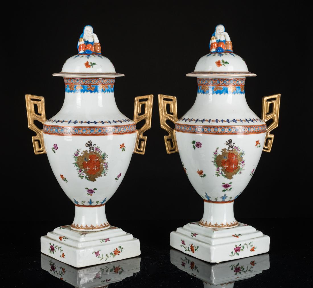 Yongzheng Period Pair Export Porcelain Vase: Comprising of baluster form with a protruding foot to a waisted neck, supported on a square base with layers of design, painted around the body with coat of arm badges surrounded by flowers, the shoul