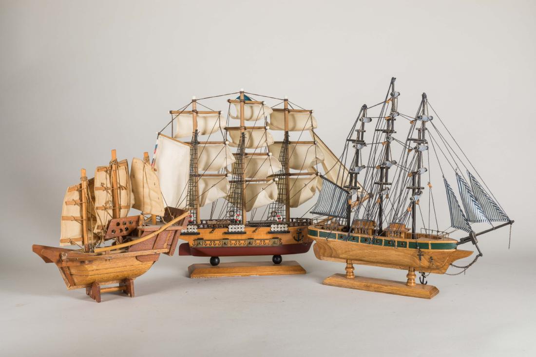 Group of Vintage Wood Ships: Consisting of three pieces of wood clipper ship models on stand, one without a sign, one of 'Cutty Sark' mark, one of 'U.S.S Constitution 1797'. 8.5 - 14 inch H, 9.5 - 18 inch W
