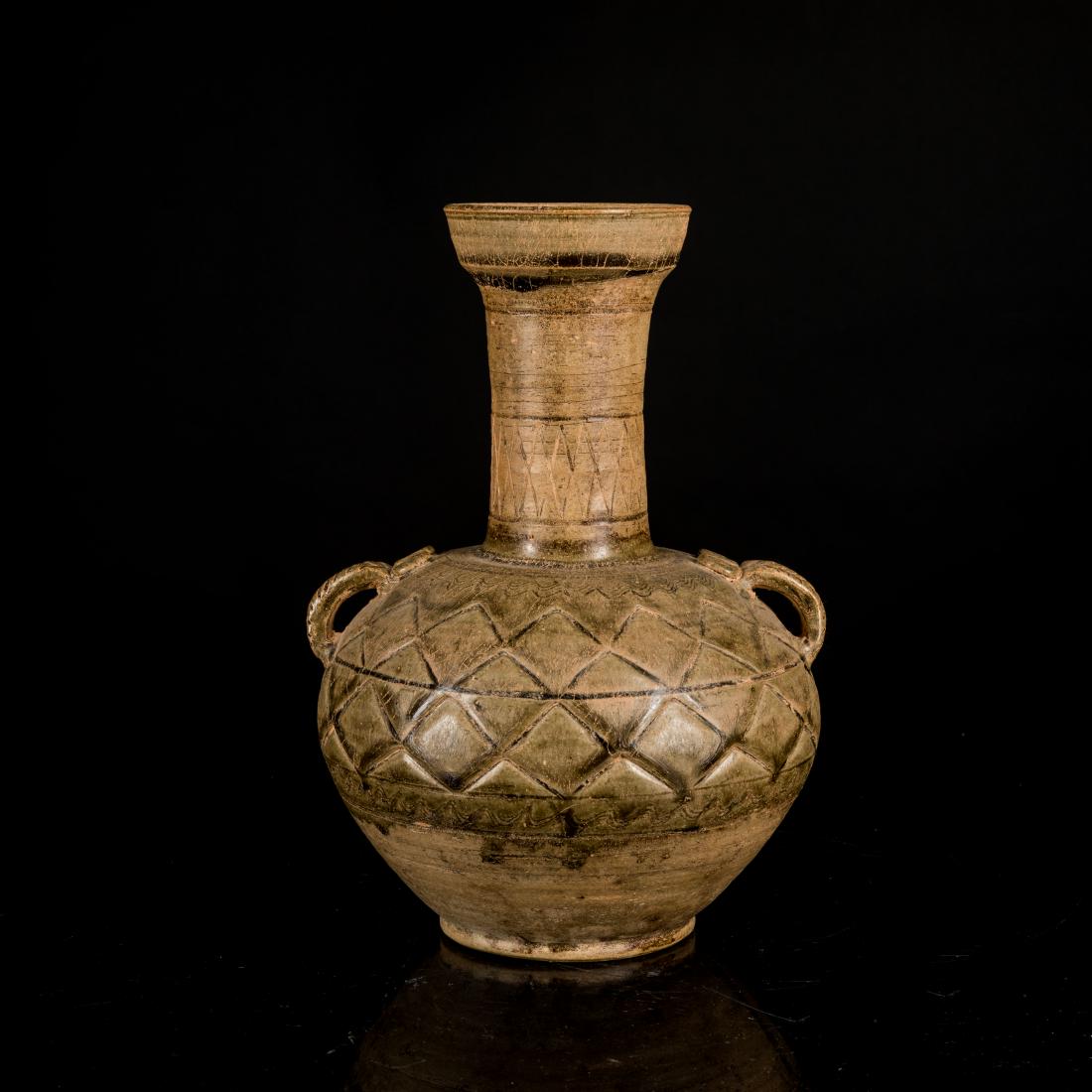 Han Dynasty Antique Pottery Jar: The compressed globular body from a flat base to a waisted tall neck and a galleried mouth, the shoulder flanked by a pair of handles, covered overall in a spinach green glaze with a thin layer of bei