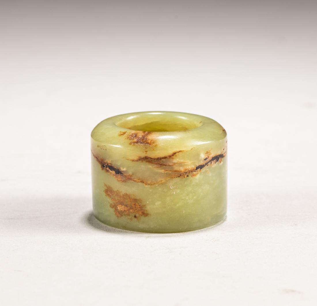 Chinese Antique Yellow Jade Thumb Ring: Ming style, nice and polished jade, the body of short cylindrical form, the stone of yellowish tone with russet inclusion. 1.3 inch Diameter; 1 inch H