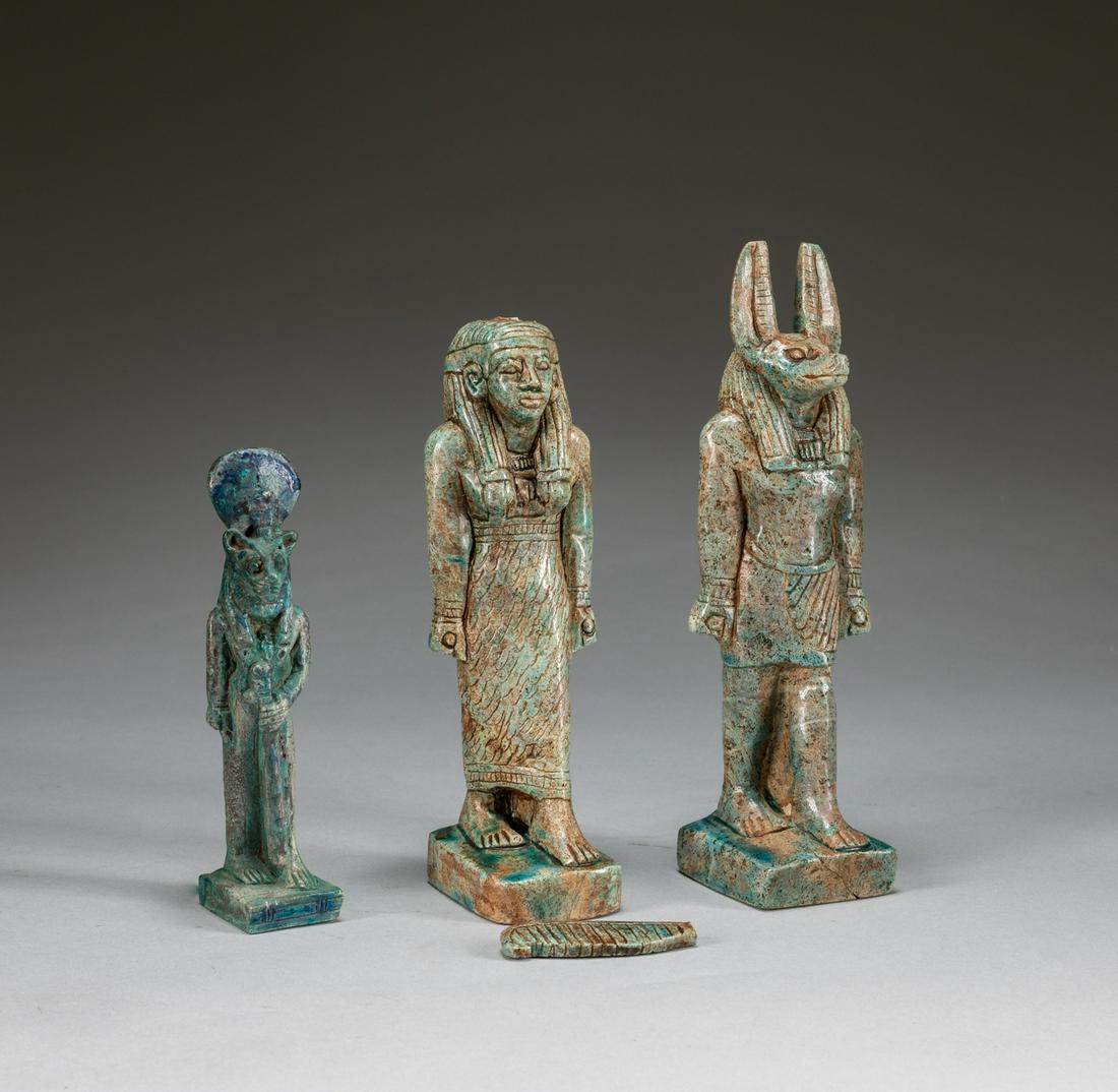 Set Of Ancient Egypt Green Glazed Figures: Set of three pieces green turquoise glazed figure, the shabti wearing a striped tripartite wig and broad collar, the face finely rendered with painted features, green glazed faience protector of tombs