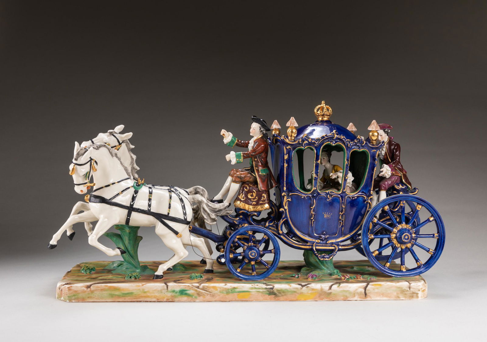 Early 20th Italy Antique Capodimonte Porcelain Figure: Capodimonte porcelain horse drawn carriage figure, all supported on a rectangular base, two horses at front pulling an ornate carriage, the ornate carriage paint in blue tone, with gilt edge, one lady