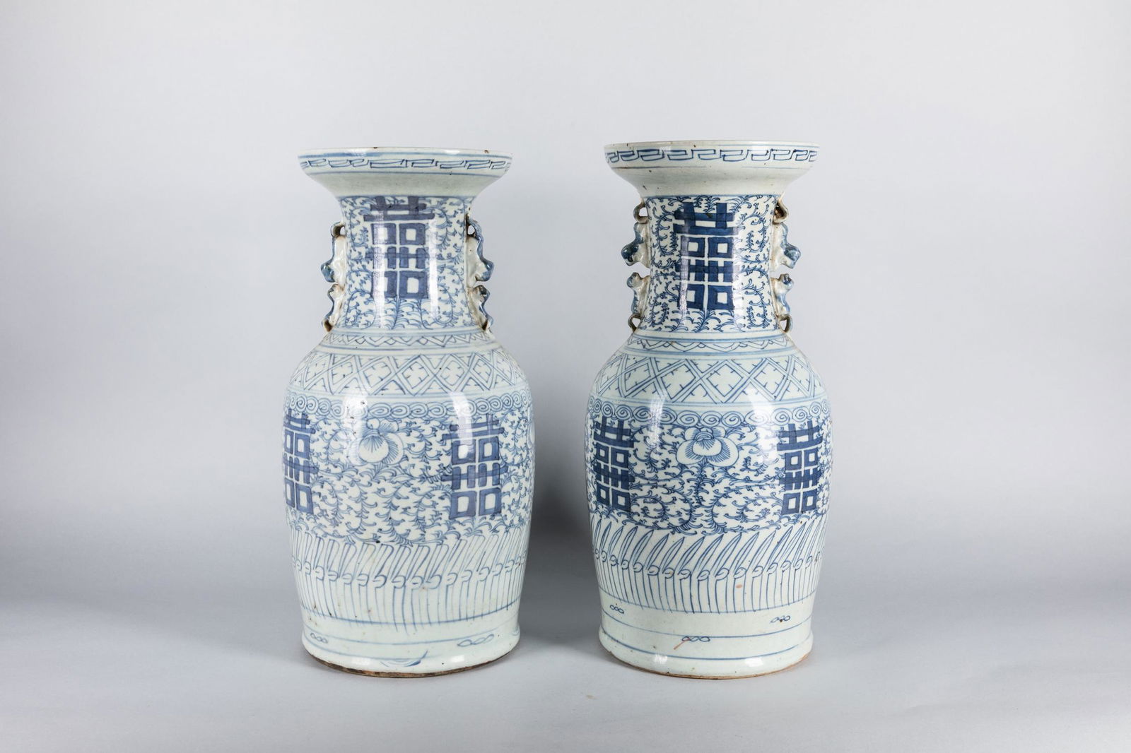 Pair Tall 19th Chinese Antique Blue White Porcelain: Each decorated with four shuangxi (double xi) characters enclosed by large stylized lotus head amongst leafy and feathery branches. 16.8*8.7 inch