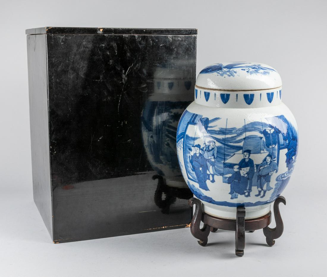 Tall Chinese Antique Blue White Porcelain Jar: Of globular form, surmounted by a short waisted neck, boldly painted around the exterior with a continuous scene, depicting scholars with attendants standing in front of the table, with a wood stand,