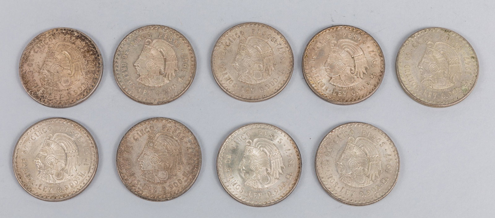 1947 Estados Unidos Mexicanos Sterling Silver Coins,9: Group of 9 pieces, Estados Unidos Mexicanos, 30 Gramos. Ley 0.900. M. 1947 Cinco Pesos. Each coin is 1 oz, total of 9 oz. the Estate of Timothy, coin dealer, Los Angeles.