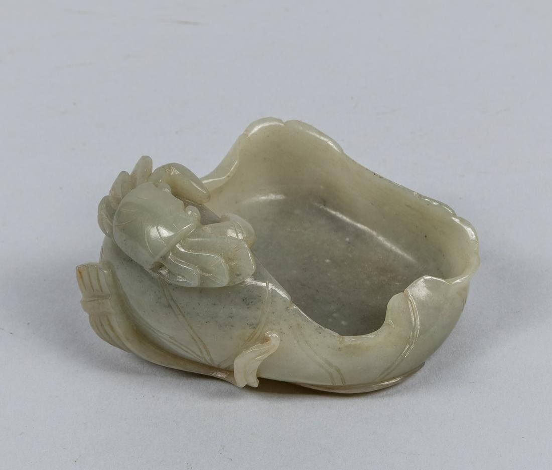 19th Chinese Antique Carved Jade Washer: Worked in the form of a large furled lotus pad, rendered borne on a stem on the underside and decorated a crab extending around the exterior. The estate of Robert Lee, 3.51*2.89 inch
