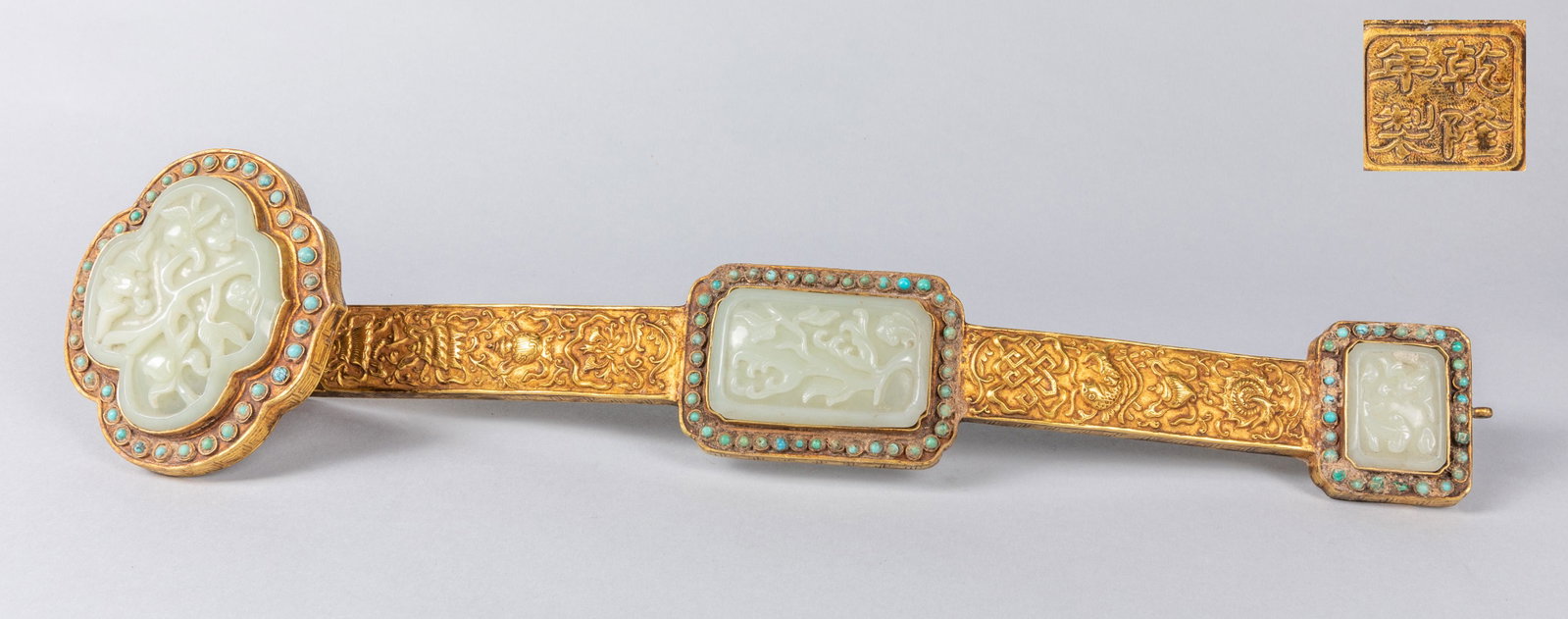 Chinese Gilt Bronze & White Jade Ruyi: Nice detailed gilt bronze ruyi with three carved white jade cover. Size: 18 inch L.
