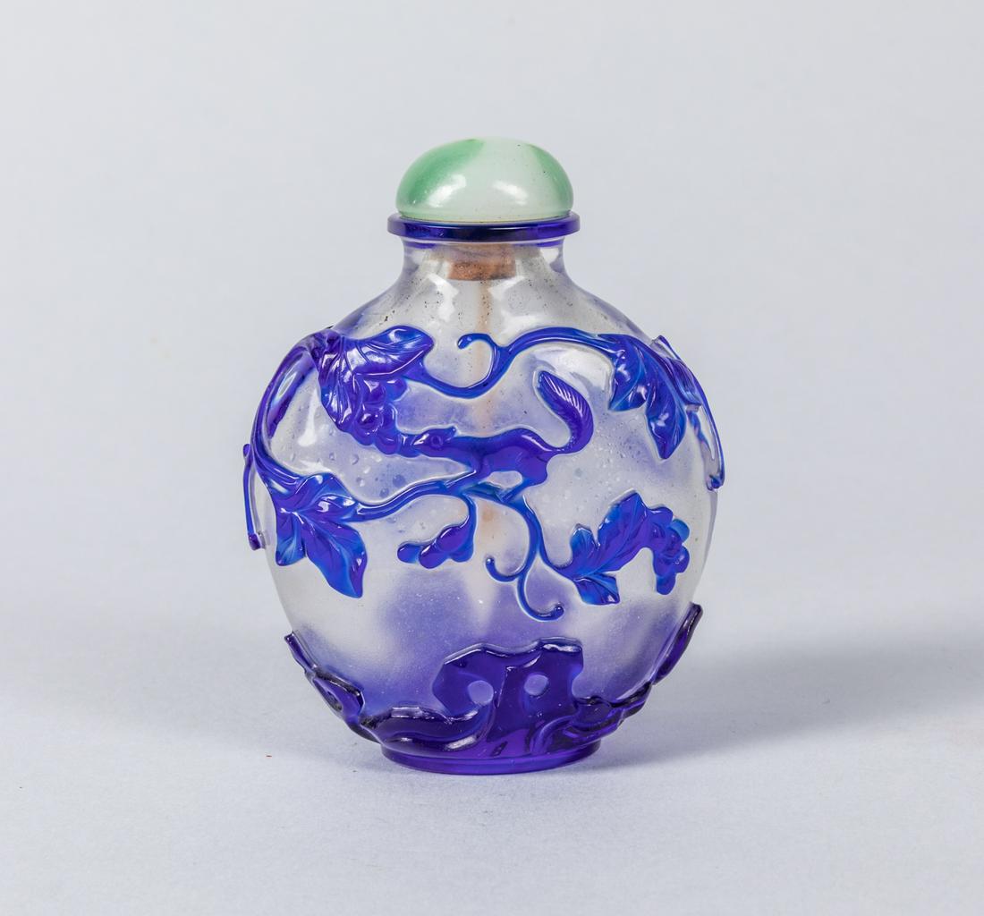 Chinese Carved Overlay Glass Snuff Bottle: Chinese overlay glass carved snuff bottle of tree and squirrel. Size: 3.25 inch H.