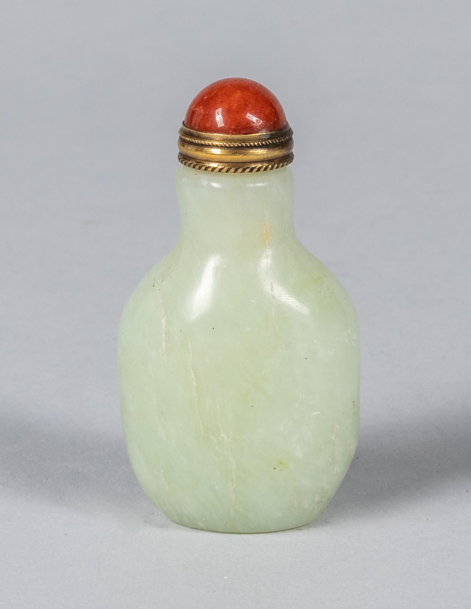 Chinese Carved Jade Snuff Bottle: Chinese pale celadon jade snuff bottle, red jadeite stopper, Size: 2.5 inch H.
