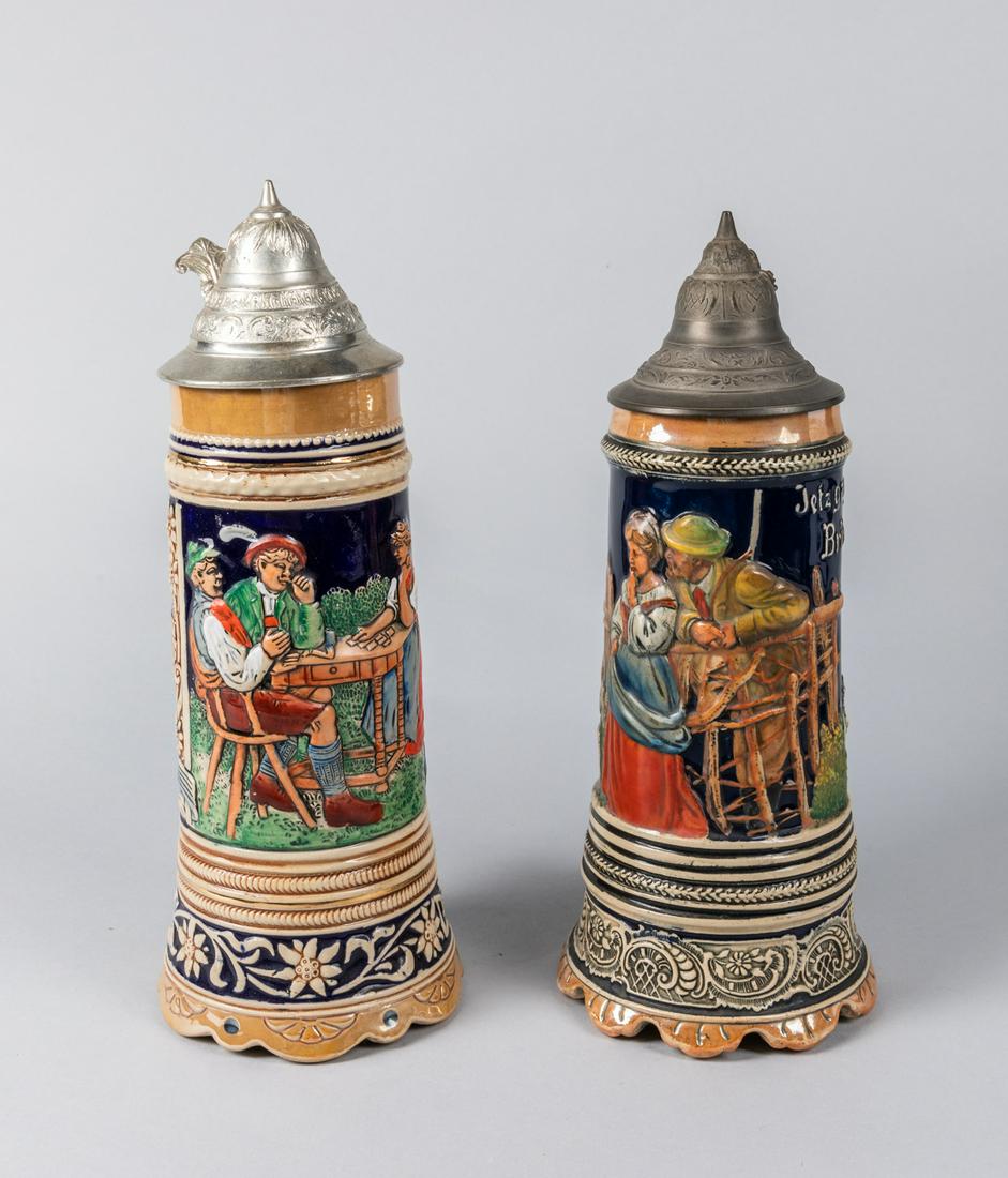 Vintage Simon Peter Gerz German Beer Stein Cup: Pairs of vintage Simon Peter Gerz German beer stein cup from Germany. One music box on the bottom of the cup. Carved tin cover with DBGM mark. Size: 11.5 inch H