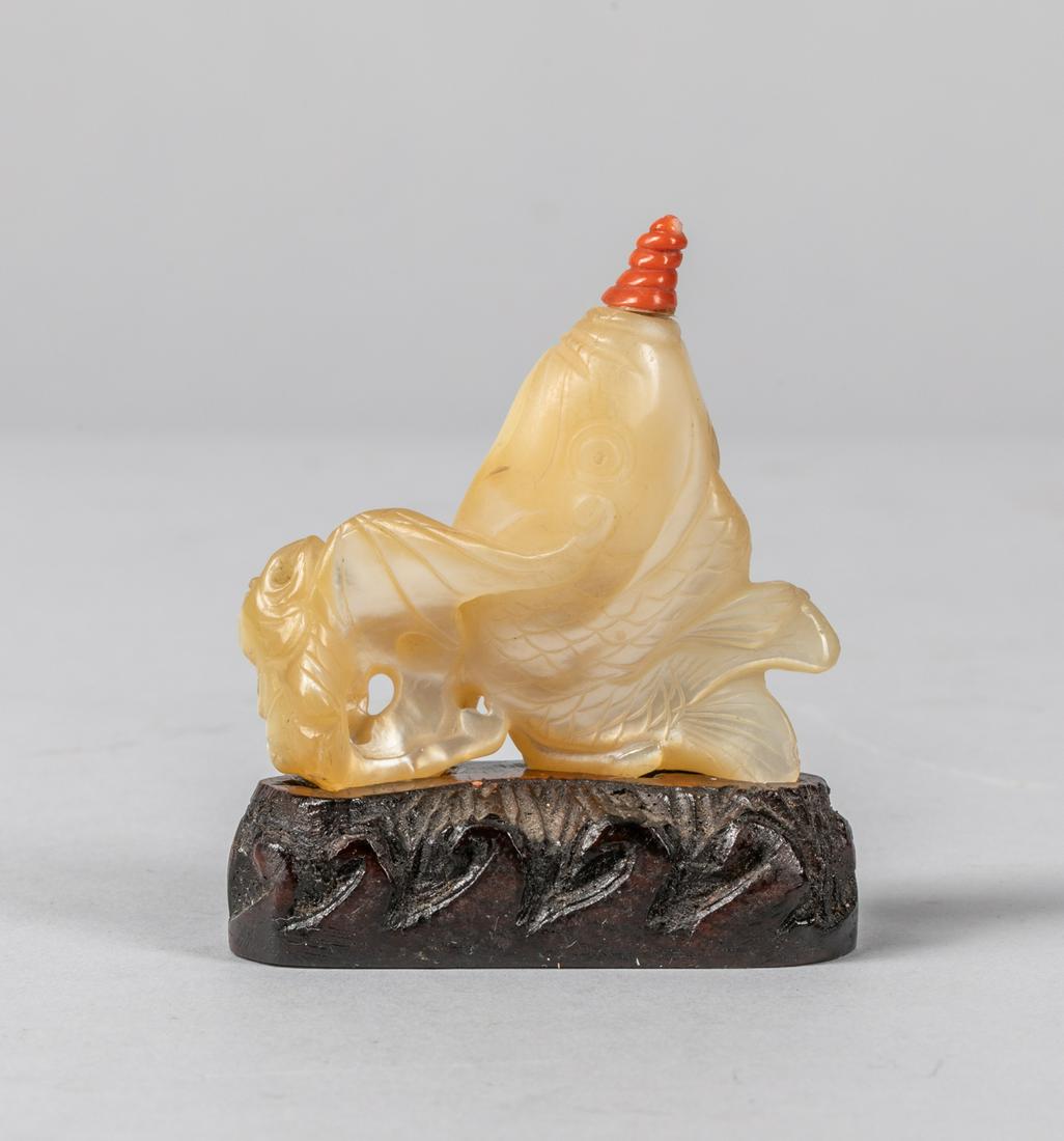 Antique Chinese Carved Mother of Pearl Snuff Bottle: Chinese old carved mother of pearl snuff bottle of fish subject, original wood stand, Coral like stopper, Signed on stand. 2.7 inch H.