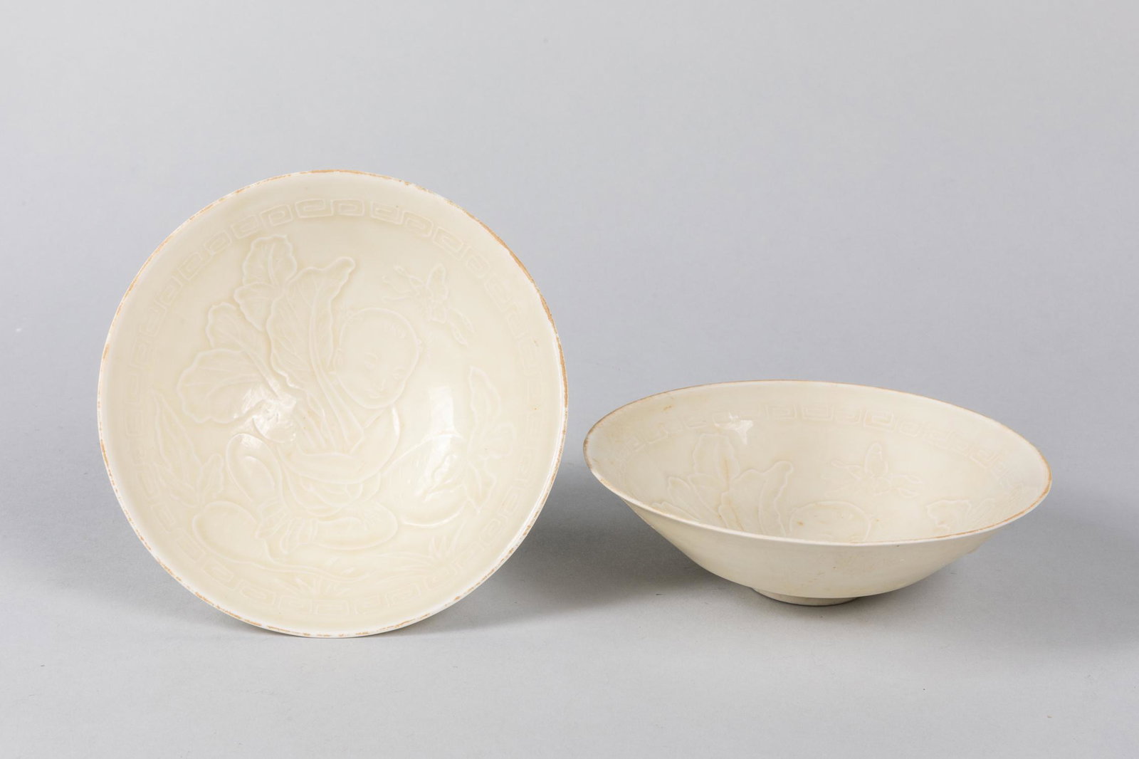 Pair Of 1950-70 Korean White Glazed Porcelain Teacups: The interior carved with blossom floral scrolls.5.8*1.8 inch