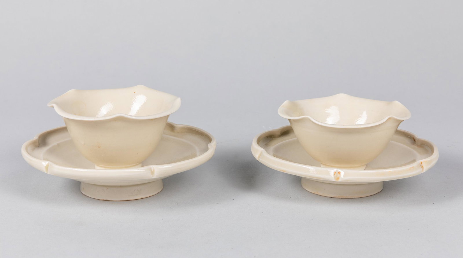 Pair of 1900-50 Korean White Glazed Porcelain Teacups: Pair of 1900-50 Korean white glazed porcelain teacup, with lobed rim. 5.1*1.2 inch (plate)