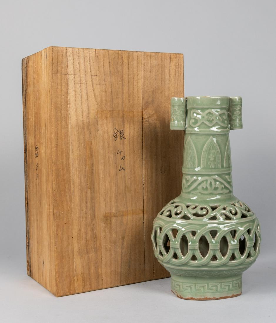 Chinese Antique Carved celadon Glazed Porcelain Vase: Chinese antique porcelain vase, carved, with original wood box, the box broken, 10 inch H. The estate of Mitsui, 1995
